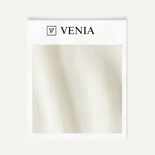 Card with 'VENIA' branding and a swatch of beige fabric on a white background