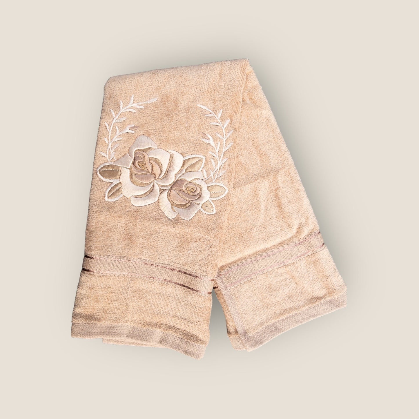 beige hand towel with floral embroidery