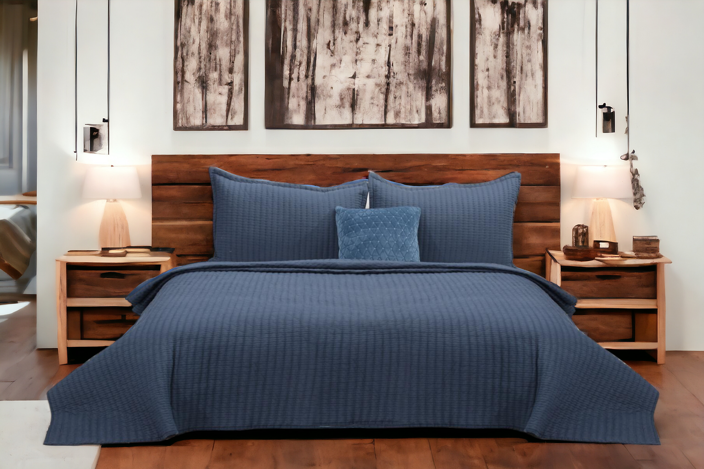 A bedcover set, spread on a bed