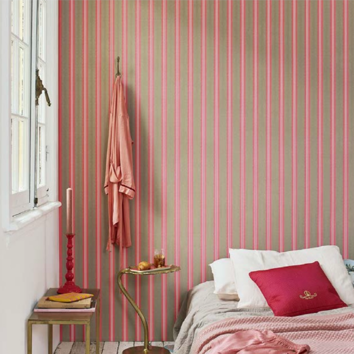 bedroom adorned with pink and grey striped wallpaper