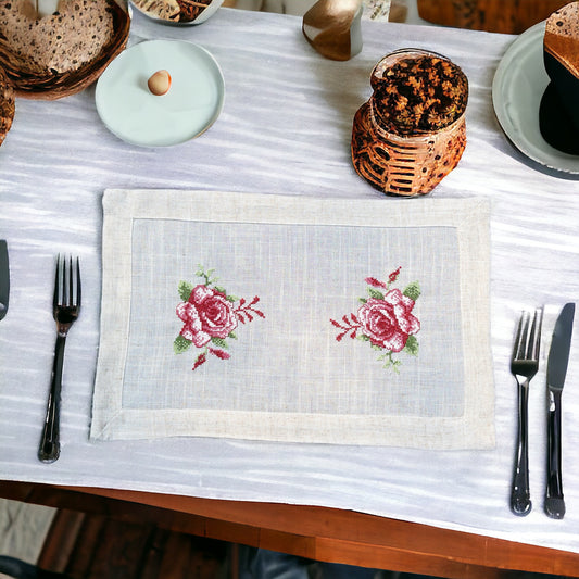 Beige linen table mat with floral print placed on a dining table