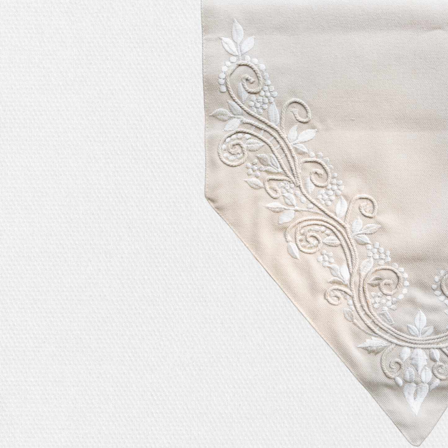 close up of embroidered detail on a table runner