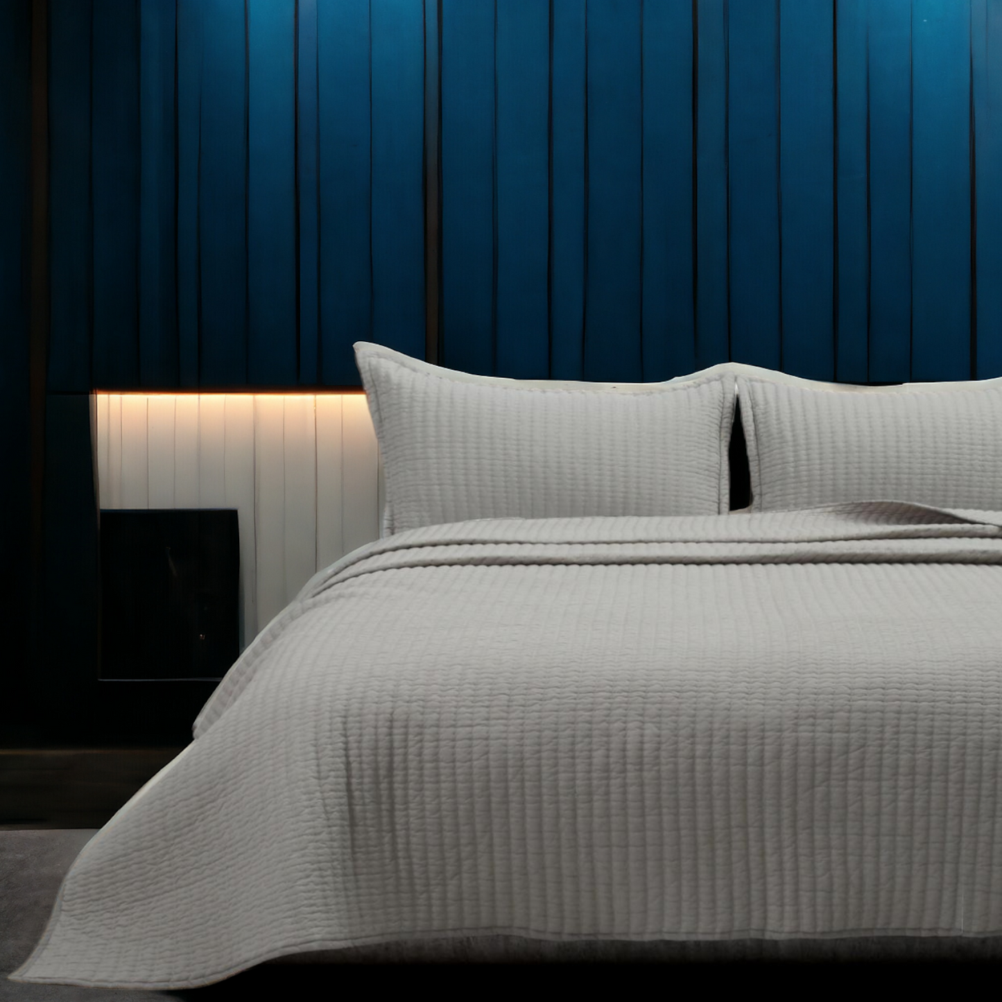 A bedcover set, spread on a bed