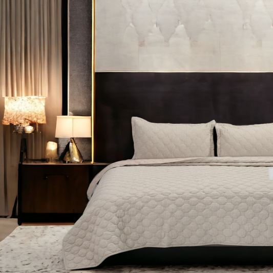 Close up of a bedcover set, spread on a bed