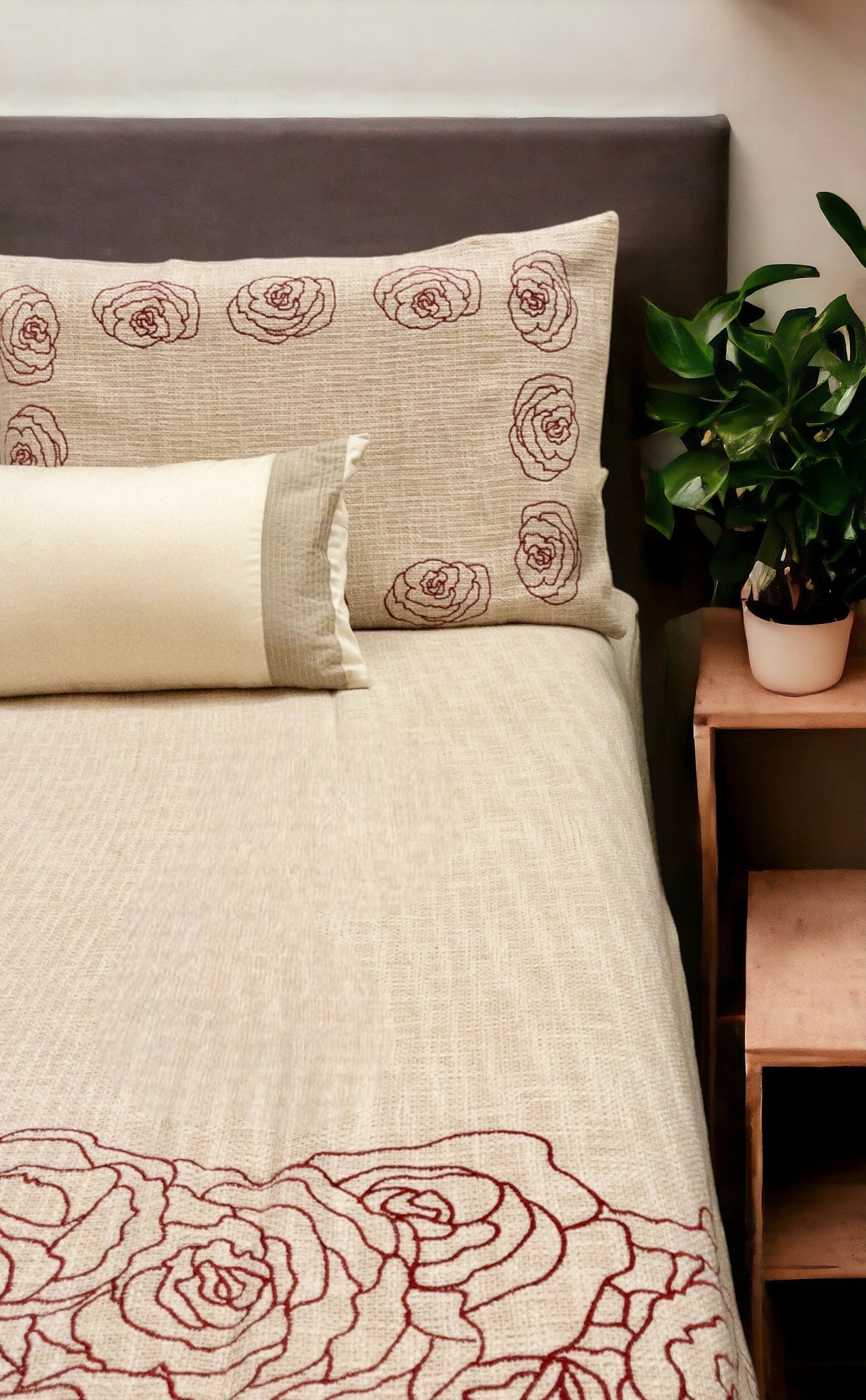 A bedcover set, spread on a bed