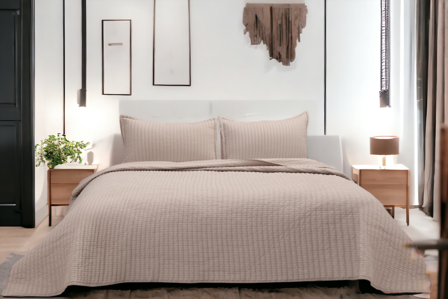 A bedcover set, spread on a bed