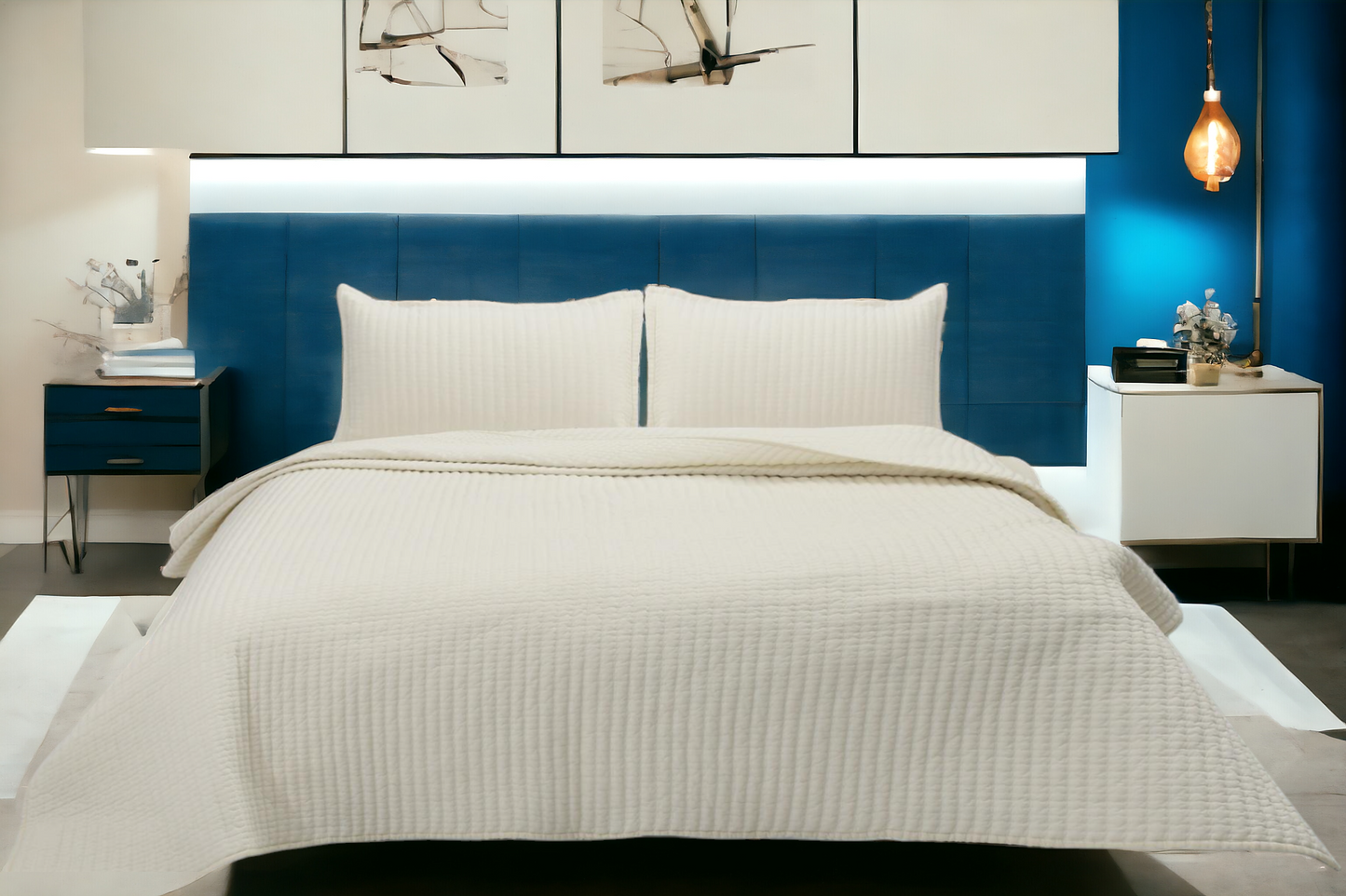 A bedcover set, spread on a bed