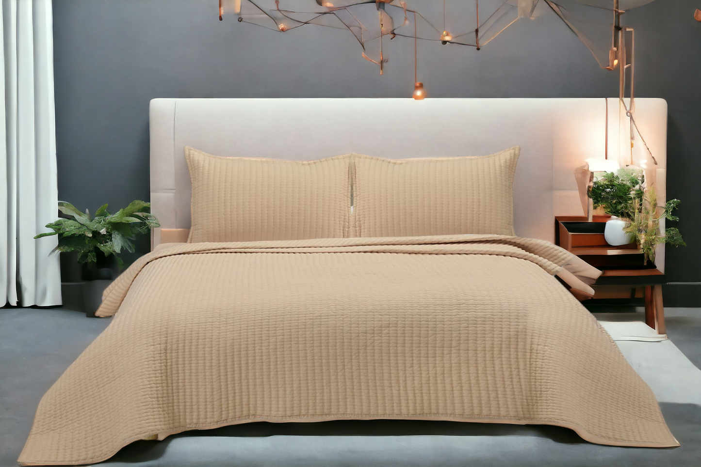 A bedcover set, spread on a bed