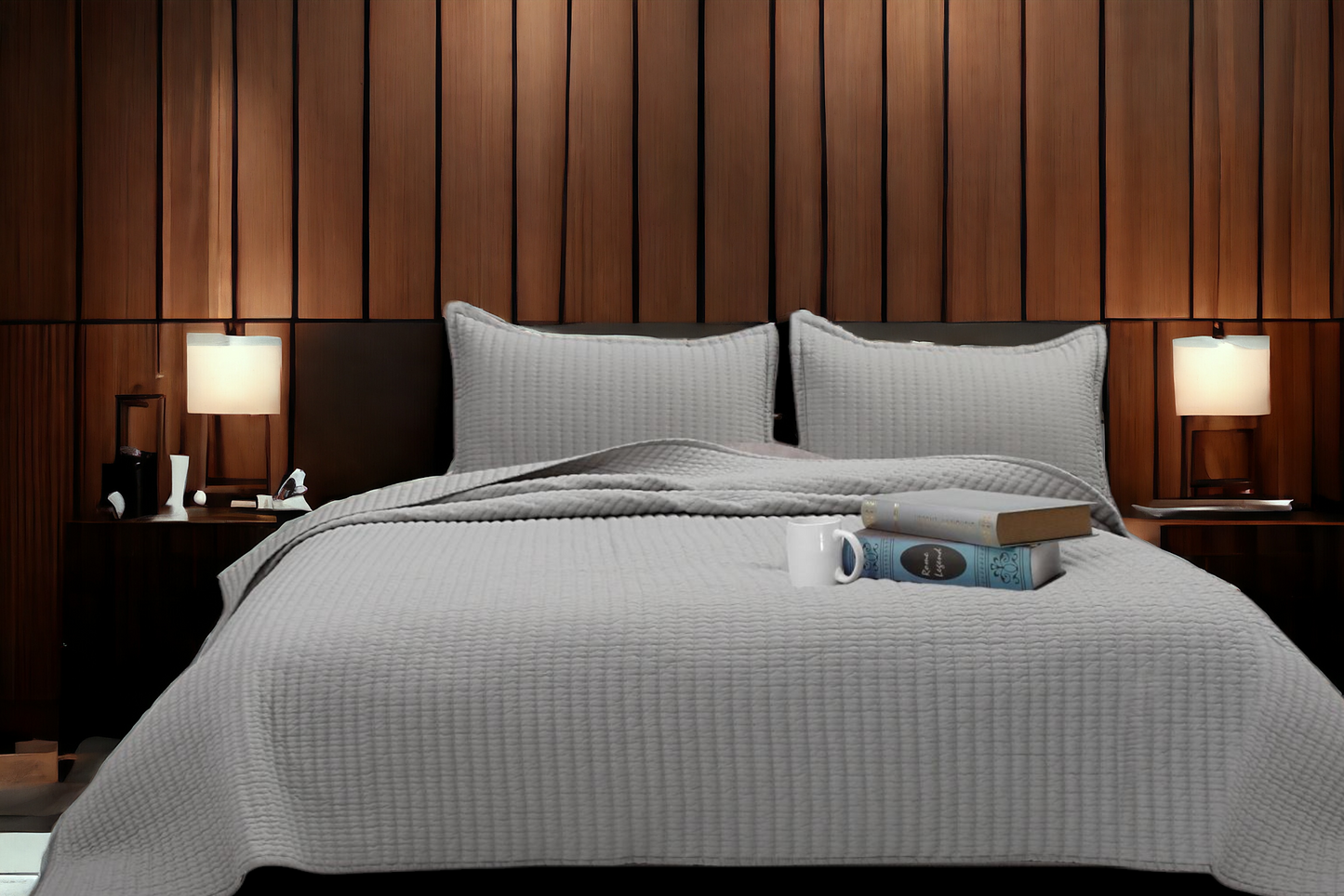 A bedcover set, spread on a bed