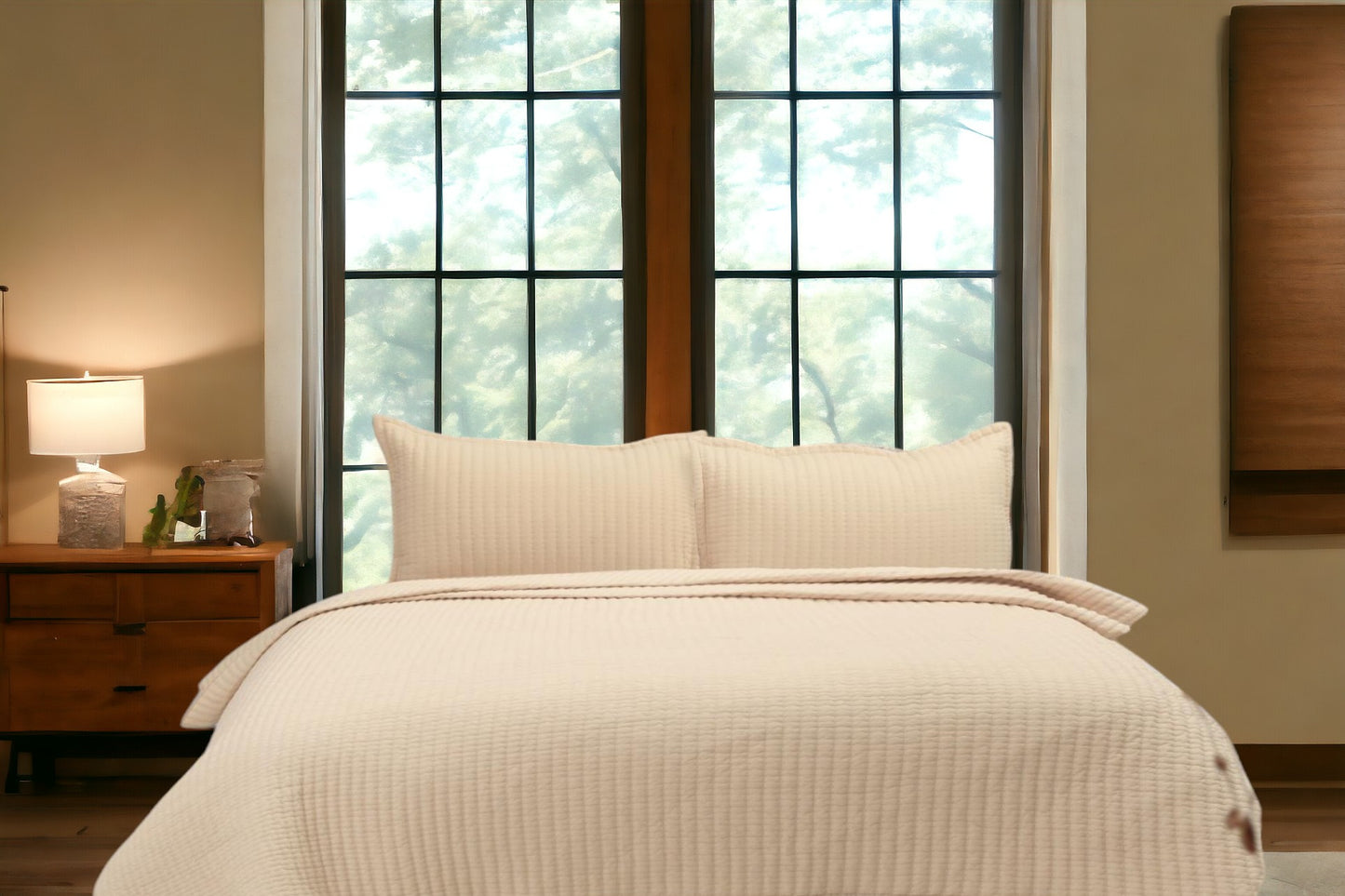 A bedcover set, spread on a bed