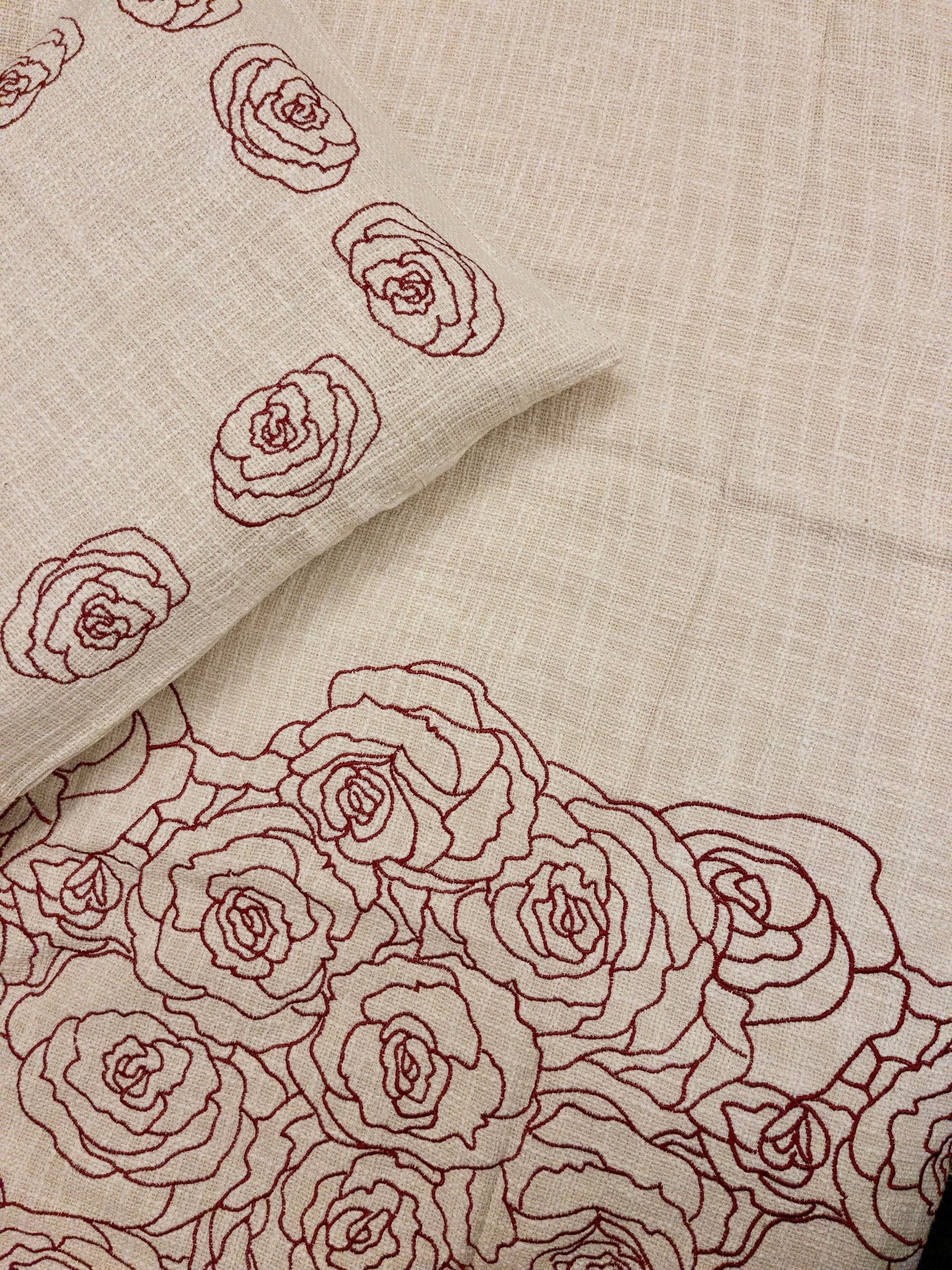 A bedcover set, spread on a bed