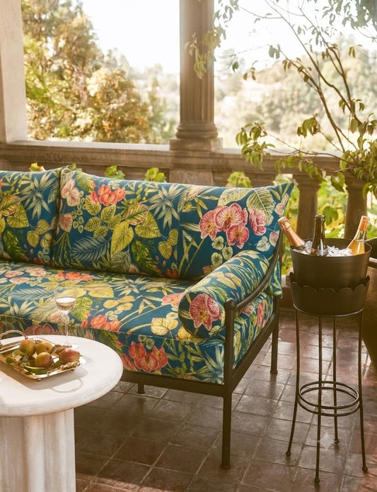Outdoor cushion styled in Bloom Coral waterproof acrylic fabric