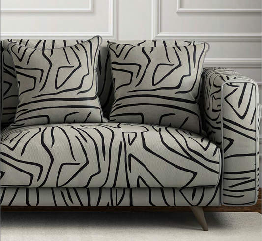 Close-up detail of warm grey contour velvet fabric