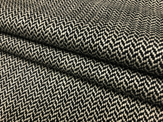 Close-up detail of herringbone black and white fabric weave