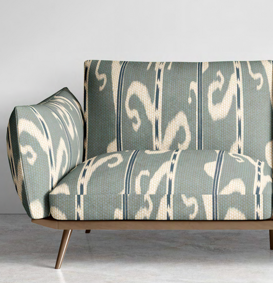 Close-up detail of blue-grey ikat scroll fabric