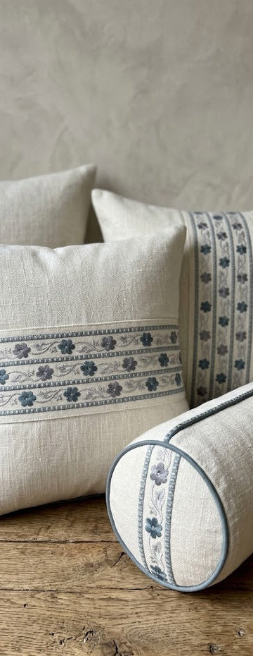 Close-up detail of blue mini daisy embroidered trim