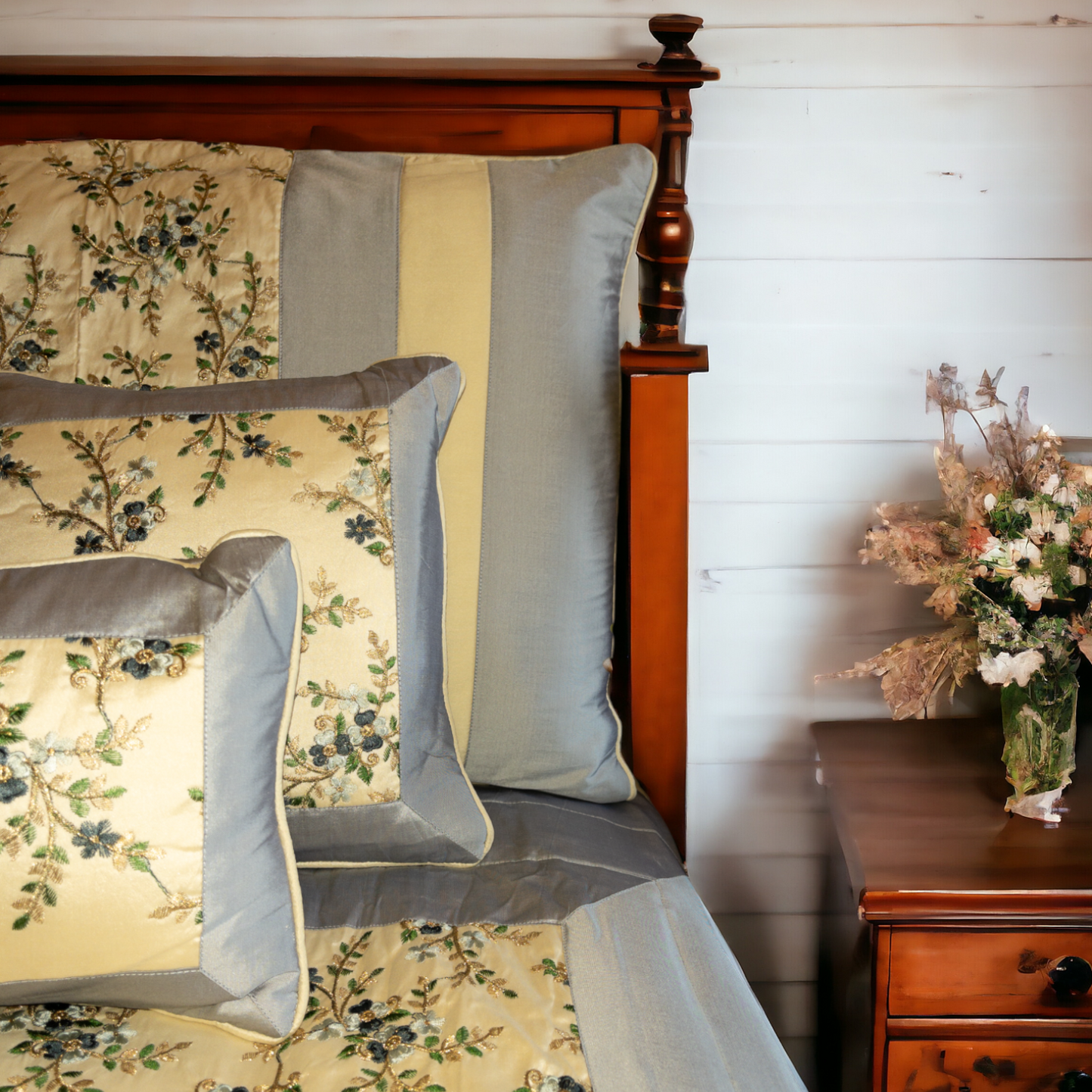A bedcover set, spread on a bed