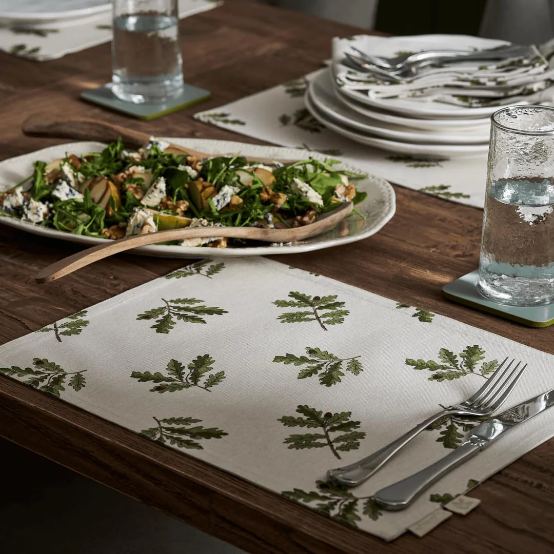 Top-down view of an elegant floral placemat, showcasing intricate details and adding a touch of nature-inspired beauty to the dining table.