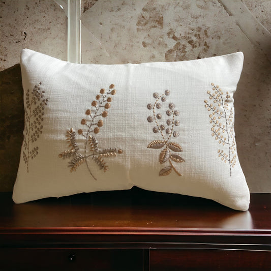 White Cushion cover on a wooden desk