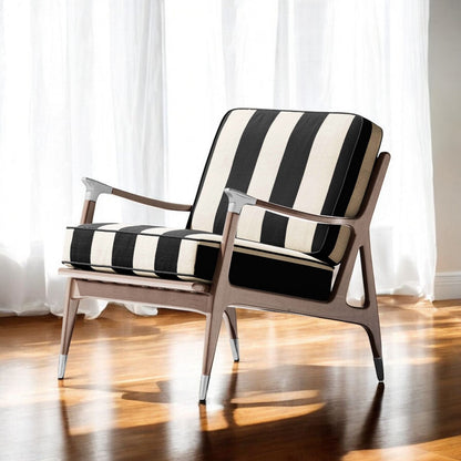 A chair with a black and white striped upholstery fabric.