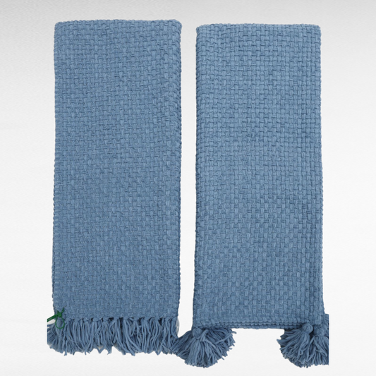 a blue knitted throw blanket