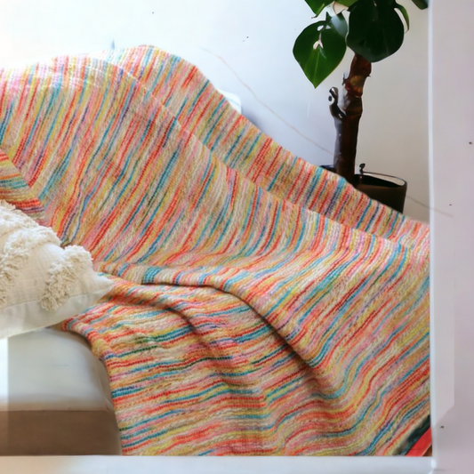 a colorful throw styled on a sofa