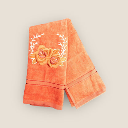 orange hand towel with floral embroidery
