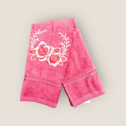 bright pink hand towel with floral embroidery