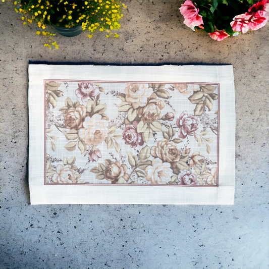 Beige  linen table mat with floral print placed on a cemented platform