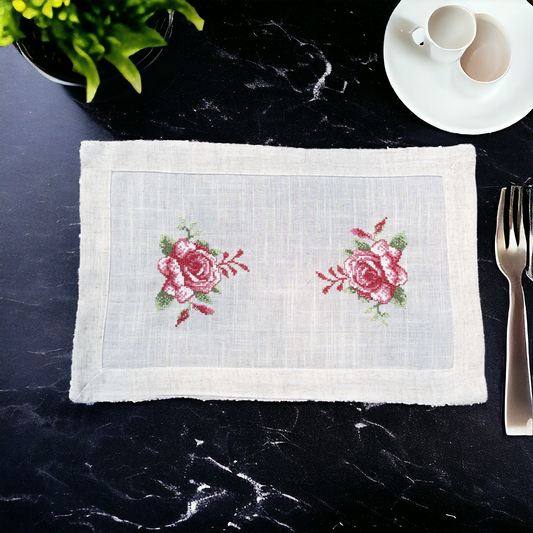 Beige linen table mat with floral print placed on a dining table