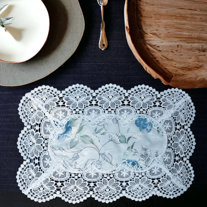 White lace table mat with floral print placed on a dining table