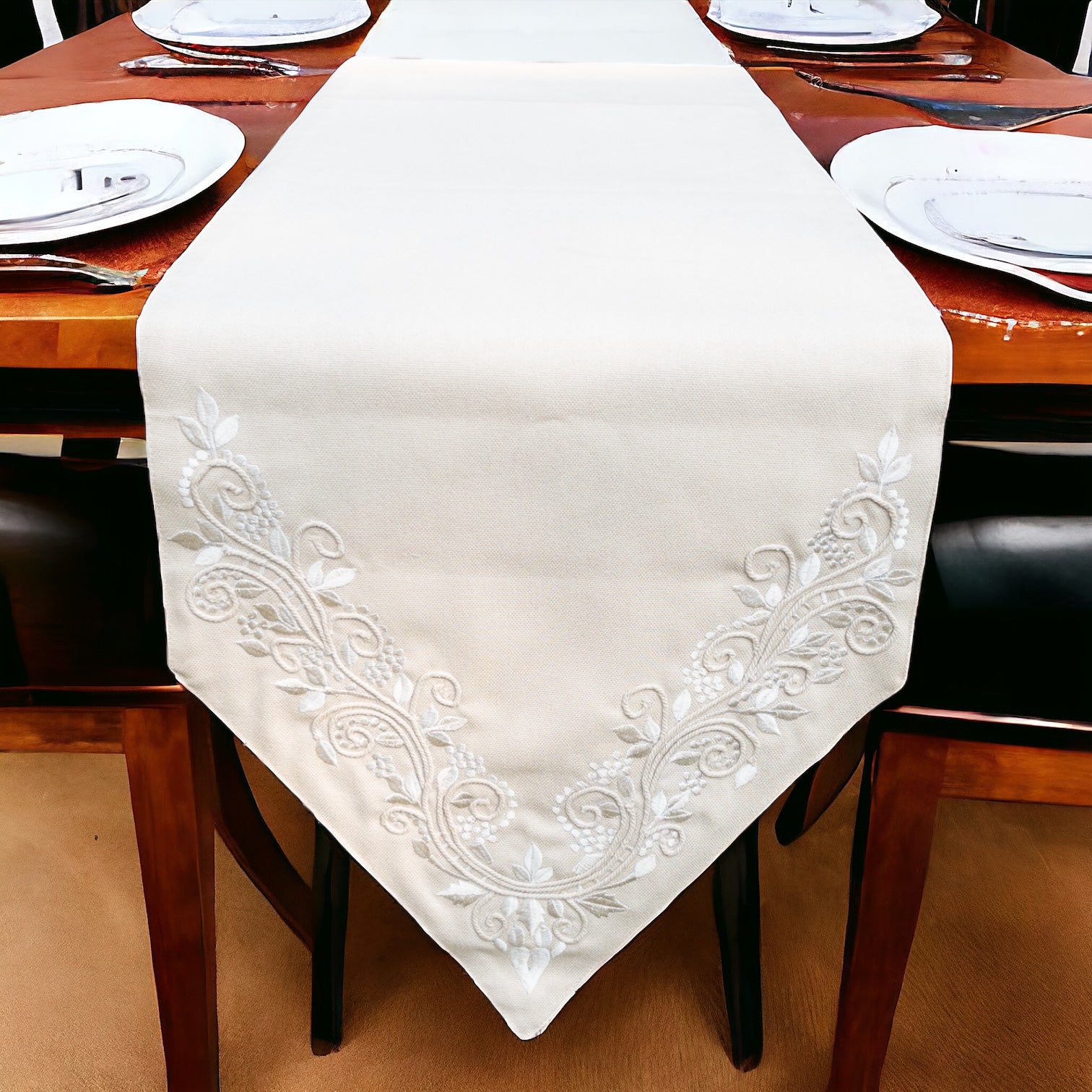 Formal table runner with embroidered detail, placed on a dining table