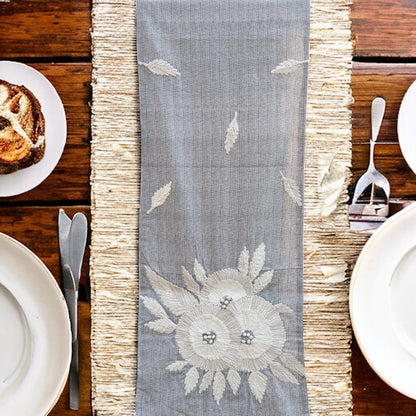 Formal grey table runner, placed on a dining table