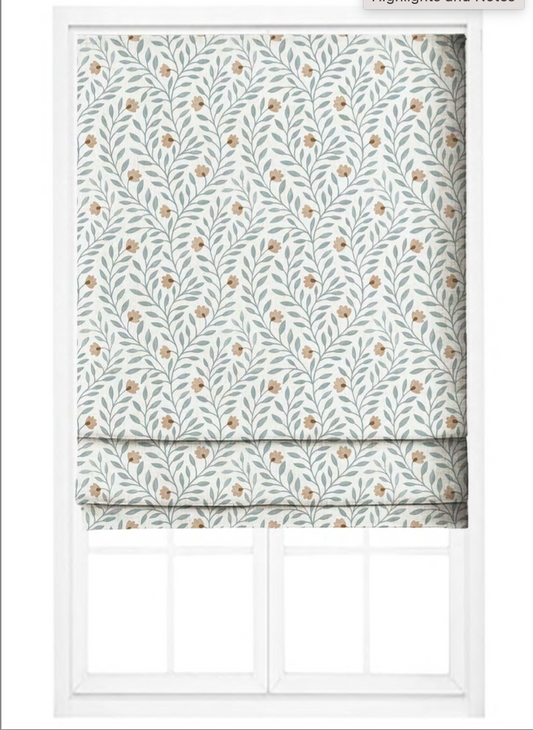 Close-up detail of beige and blue cottage vine fabric
