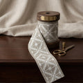 Beige criss cross embroidered trim swatch by Venia Home