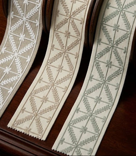 Criss cross embroidered trim collection in ivory, beige and sage styled together