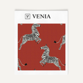 Warm red dancing zebra upholstery fabric swatch by Venia Home