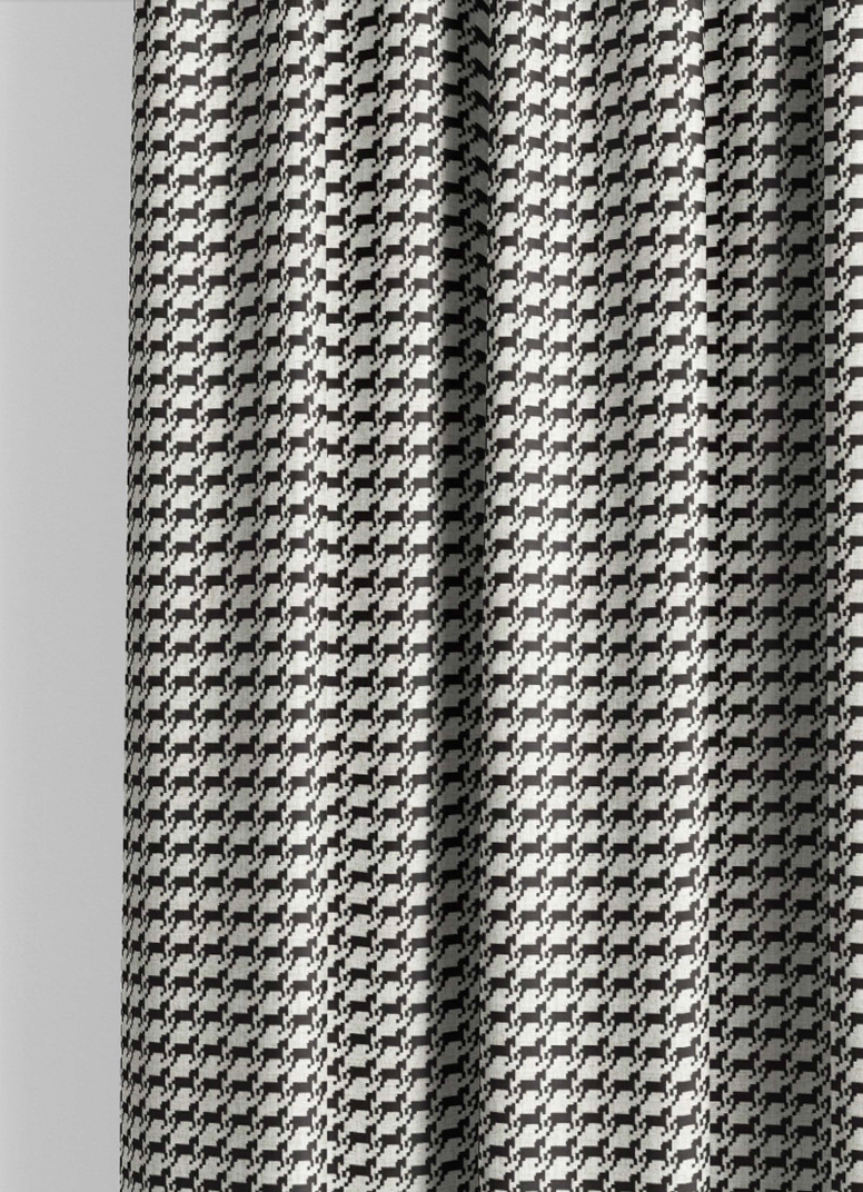 Close-up detail of ivory and black heritage houndstooth fabric
