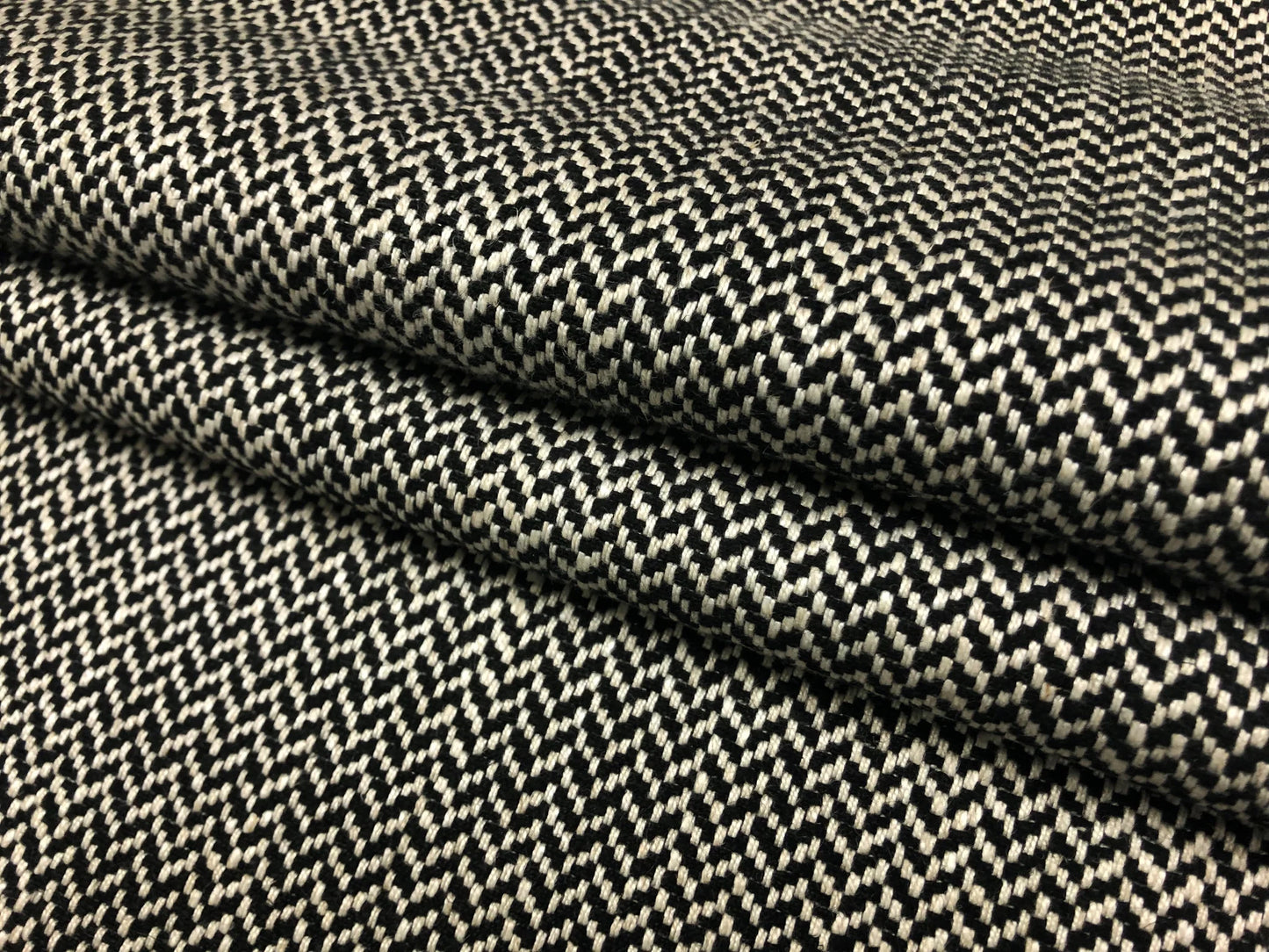 Close-up detail of herringbone black and white fabric weave
