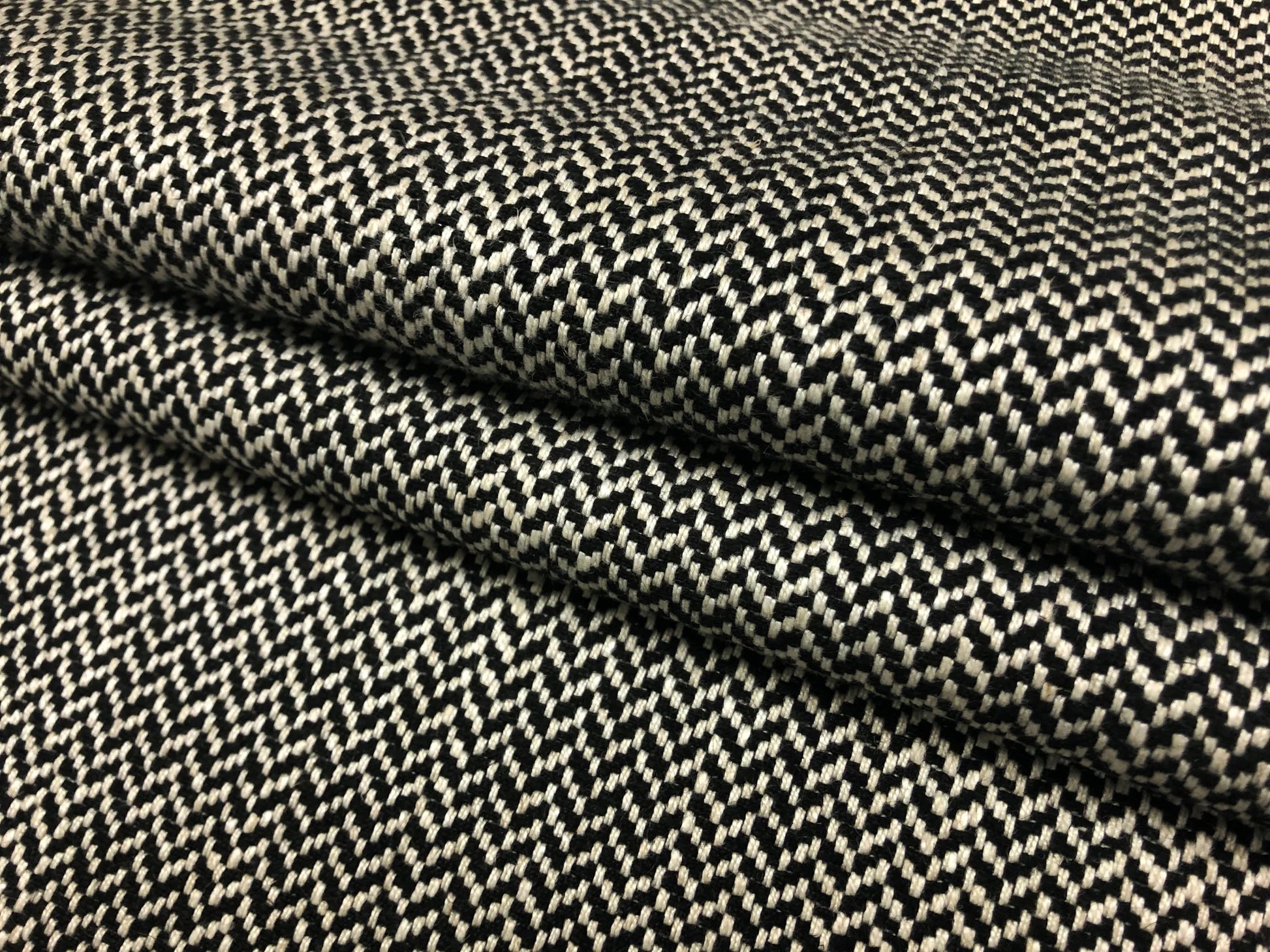 Close-up detail of herringbone black and white fabric weave