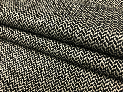 Close-up detail of herringbone black and white fabric weave