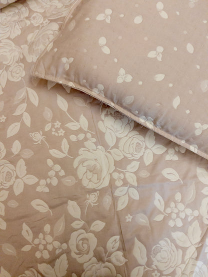 Close up of a bedcover set, spread on a bed