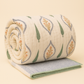 Leher block print quilt styled on a bed