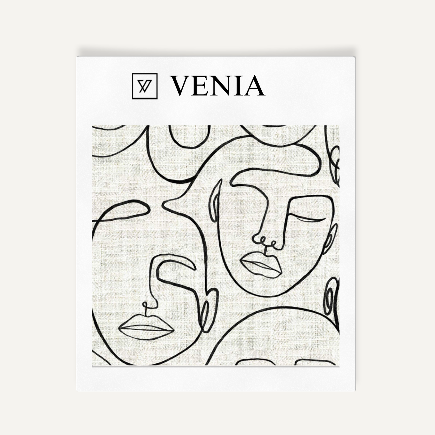 Ivory and black Muse faces upholstery fabric swatch by Venia Home