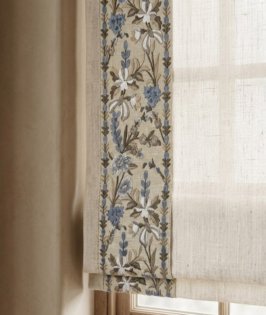 Close-up detail of blue paradise garden embroidered trim