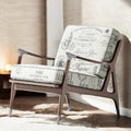 Charcoal Parisian script fabric on an accent chair