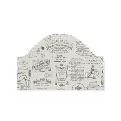 Charcoal Parisian script fabric on a headboard