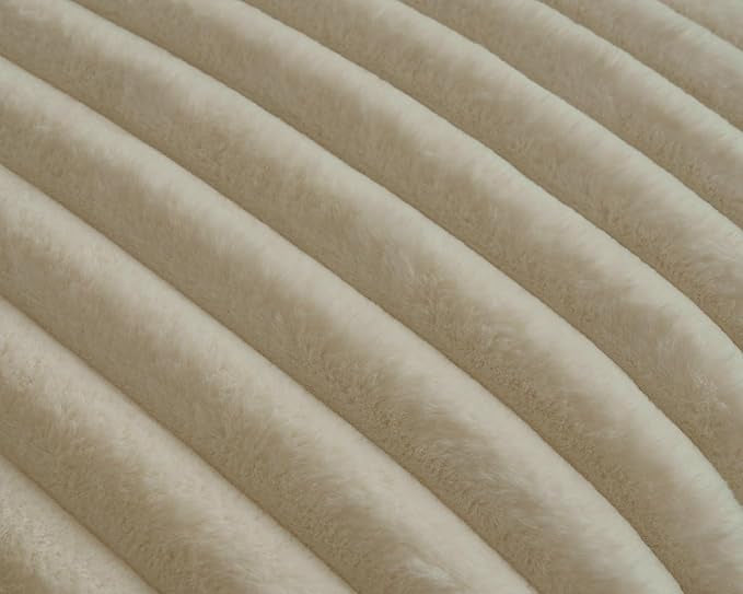 Texture of beige plush ridges faux fur fabric