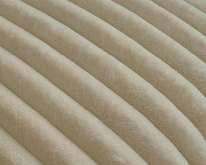 Texture of beige plush ridges faux fur fabric