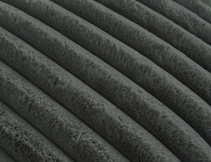 Texture of onyx noir plush ridges faux fur fabric